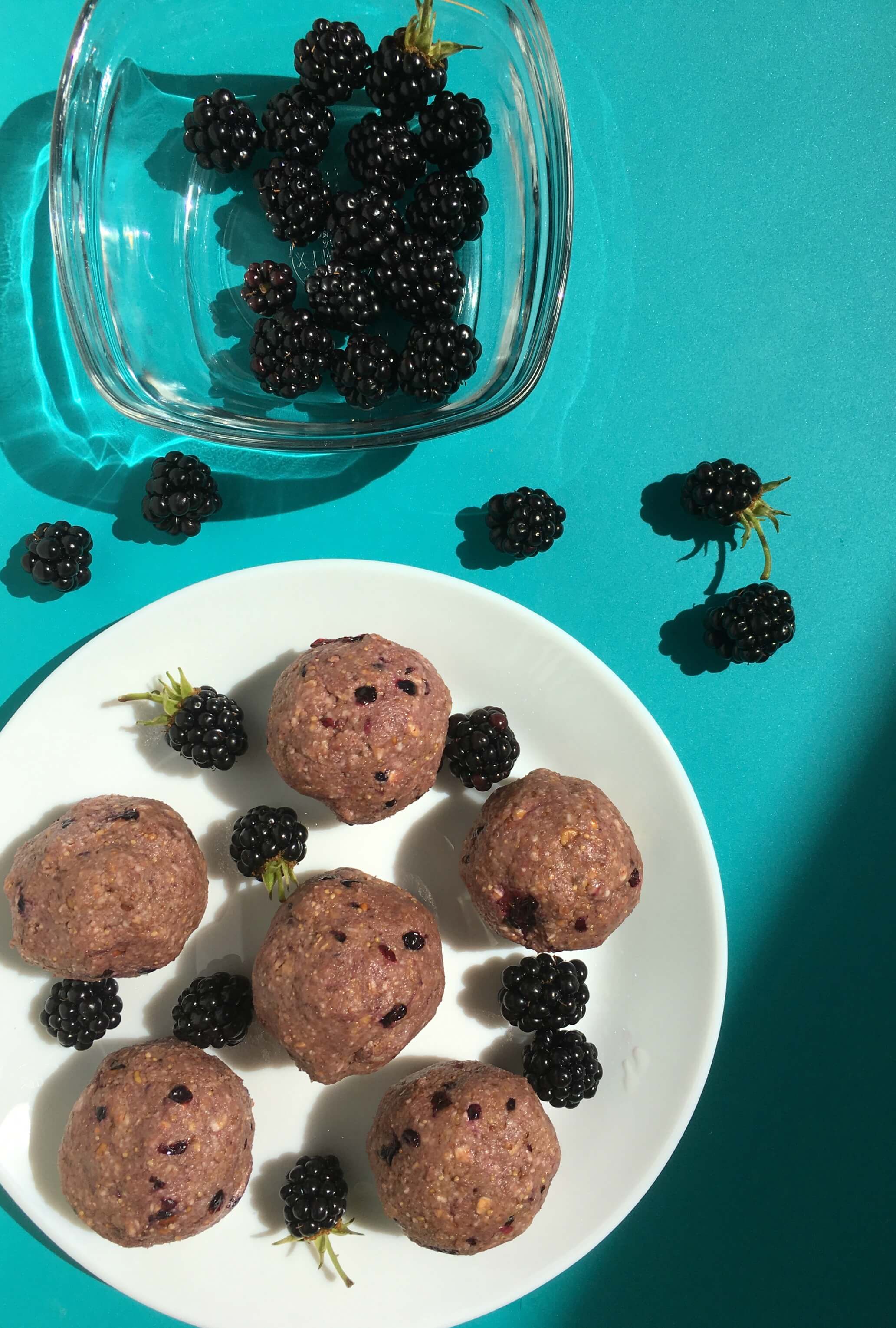 Blackberries and Energy Balls on Blue Background