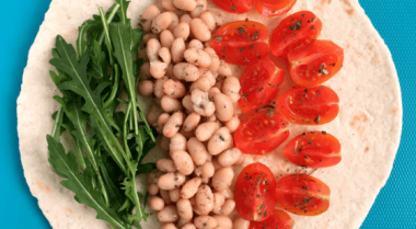 This tasty Bean Wrap is ready in 10 minutes, making it a perfect, quick weeknight dinner. It’s packed with beans (protein), tomatoes and rockets/arugula (vitamins). | The Green Loot #vegan #dinner