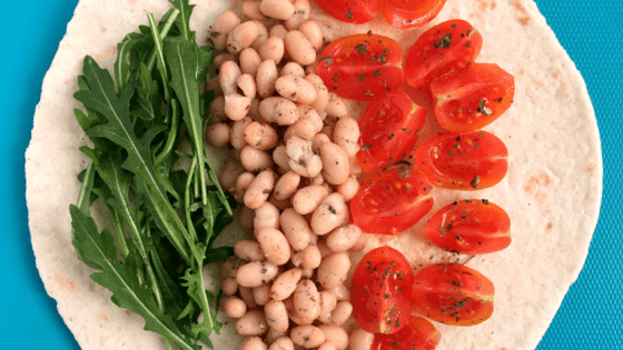 This tasty Bean Wrap is ready in 10 minutes, making it a perfect, quick weeknight dinner. It’s packed with beans (protein), tomatoes and rockets/arugula (vitamins). | The Green Loot #vegan #dinner