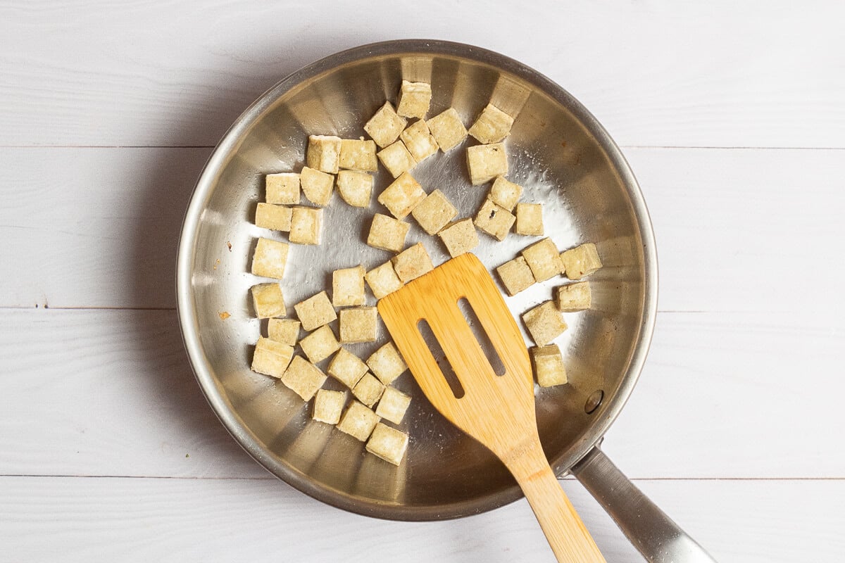 frying tofu in a pan
