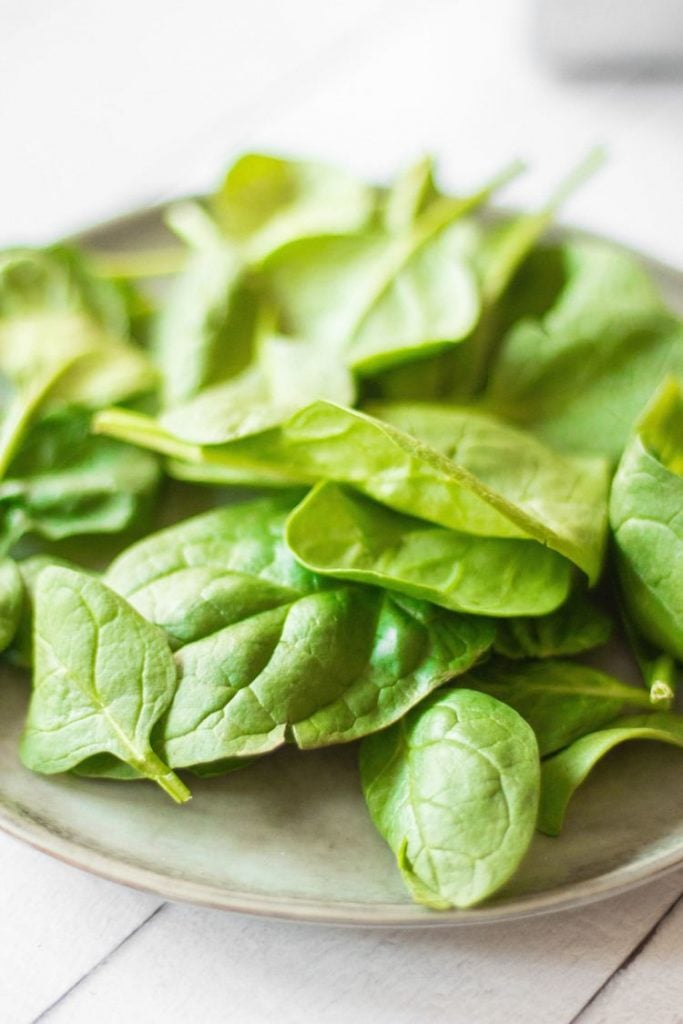 fresh spinach leaves on a plate