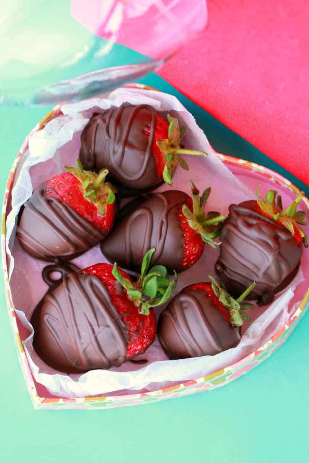 Chocolate covered strawberries in heart shaped bowl