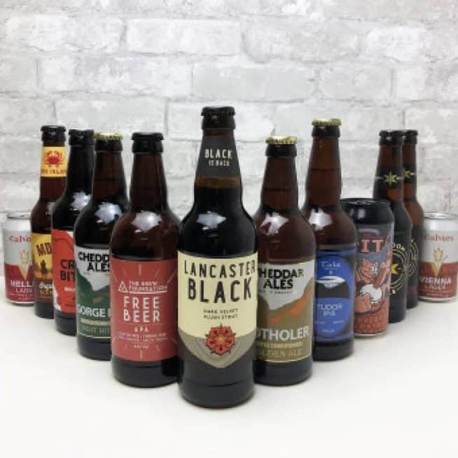 Selection of craft beer bottles lined up on table